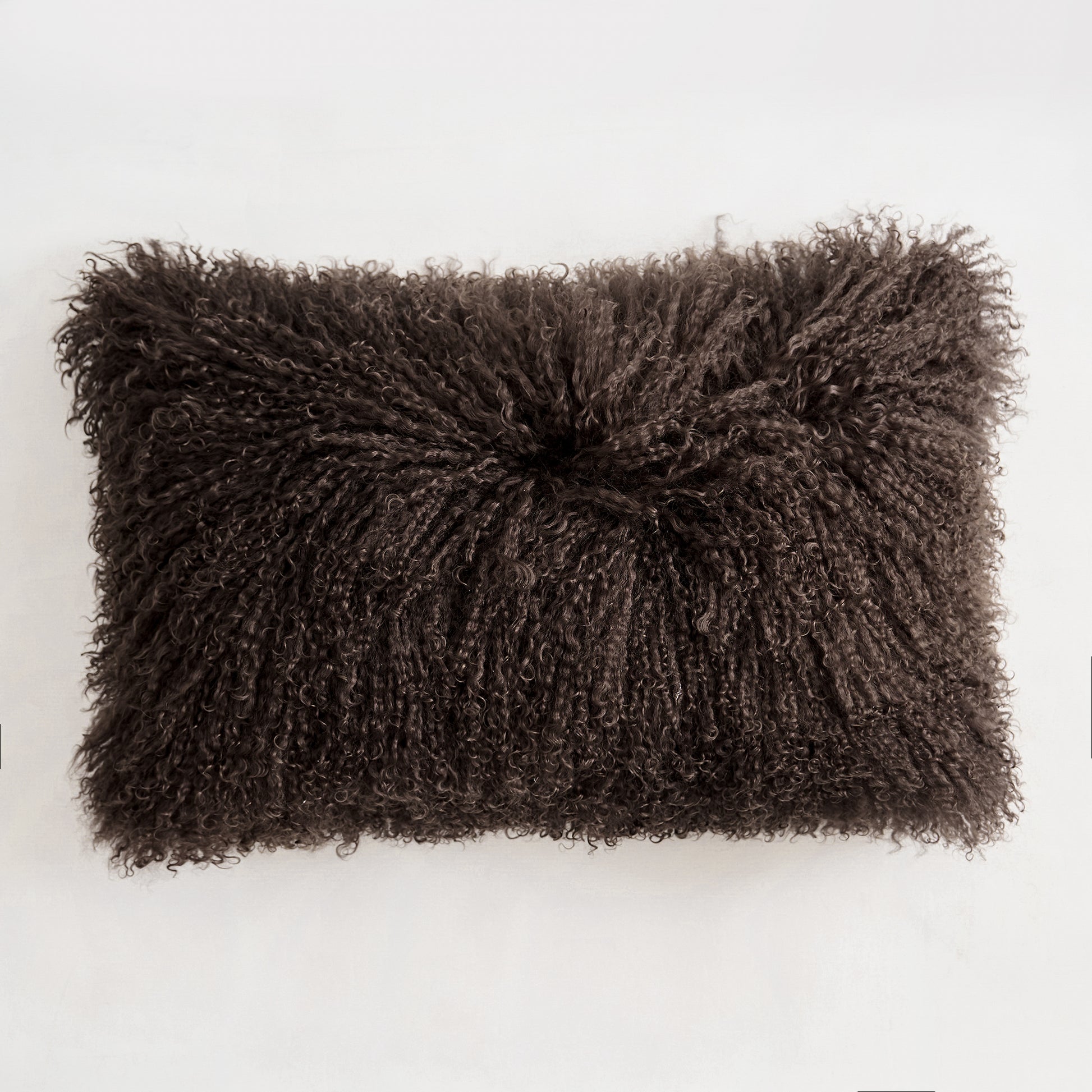 Chocolate Brown Mongolian lamb fur pillow on a white background