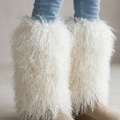 Close-up of white Mongolian lamb fur boot covers showing soft, curly genuine lamb fur texture.